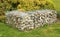 Angled decorative pebble gabion in an urban green space