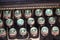 Angled shot of keys on an antique typewriter.
