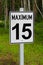 An angled view of a maximum 15 speed limit sign