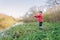 Angler athlete casts spinning rod into the river