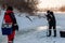 The angler drills a hole in the ice for ice fishing