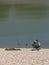 Angler Enjoying Peace At Lake Shore