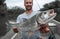 Angler holds big Asp fish