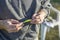 Angler holds fishing rod and spinning bait