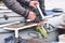 An angler installs an echo sounder on board the boat