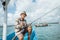 angler smiling with thumbs up on a small fishing boat