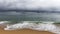 Angler on Taquaras beach with a stormy sky, Brazil