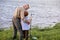 Anglers. Family bonding. Boy with grandfather fishing outdoor over river in nature