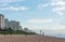 Anglers and Lifeguards on the Umhlanga Rocks beachfront with Millennium Pier and Lighthouse in the distance