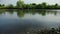 Angling, two men fishing on the river, standing in the water, a small current