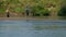 Angling, two men fishing on the river, standing in the water, a small current