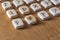 Anglo-saxon wooden handmade runes on the vintage table On each rune symbol for fortune telling is designated