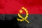 Angola polygonal flag. Mosaic modern background. Geometric design