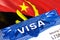 Angola Visa in passport. USA immigration Visa for Angola citizens focusing on word VISA. Travel Angola visa in national