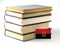 Angolan flag with pile of books on white background