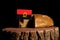 Angolan flag on a stump with bread