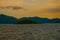 Angra dos Reis, Brazil, Ilha Grande: Beautiful scenery with ships overlooking the sea and mountains at sunset