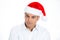 Angry, annoyed man in red santa hat