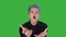 Angry annoyed young man screaming and shouting on green screen