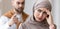Angry Arab Husband Threatening Frustrated Wife Standing At Home, Panorama