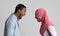 Angry black muslim couple yelling at each other