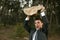 Angry businessman outdoor, big stone in hands