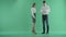 Angry Businessman Scolding His Female Colleague And Throwing Papers Up In Air on a green screen