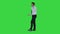 Angry businessman yelling at phone on a Green Screen, Chroma Key.