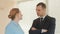 Angry businessmen, man and woman in the office, shouting at each other close-up