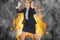 Angry businesswoman gesturing against fire