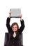 Angry businesswoman throwing her laptop