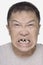 Angry Chinese man with bad teeth  portrait