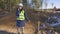 Angry civil engineer using phone on road