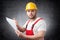 Angry construction worker holding papers