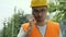 Angry construction worker screaming on the phone.