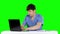 Angry doctor working at the computer. Green screen