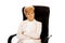 Angry elderly business woman sitting on armchair with folded arms