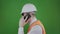 Angry engineer or builder nervously talking on phone about construction works. Chromakey. Boss or chief in a white