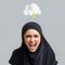 Angry excited young islamic lady in hijab freaking out, scream mouth with abstract cloud of lightning and rain sign