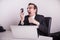 Angry and frustraded business man screaming on a cell phone in the office