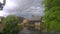 Angry, grey, storm clouds gathering over the end of navigation on the river