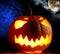 Angry halloween pumpkin and full moon