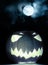 Angry halloween pumpkin and full moon