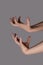 Angry hands expression. Spooky or creepy hands gesture  on grey background. Scary zombie halloween hands