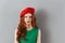 Angry lady in green dress and red beret