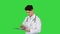 Angry male doctor looking at documents on a Green Screen, Chroma Key.