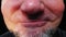 Angry man.Closeup mouth of man with crooked teeth.Unshaven aggressive man swears