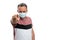 Angry man wearing medical surgical mask pointing finger at the camera