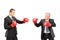 Angry mature boss and young businessman with red boxing gloves