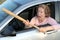 Angry mature female driver holding baseball bat